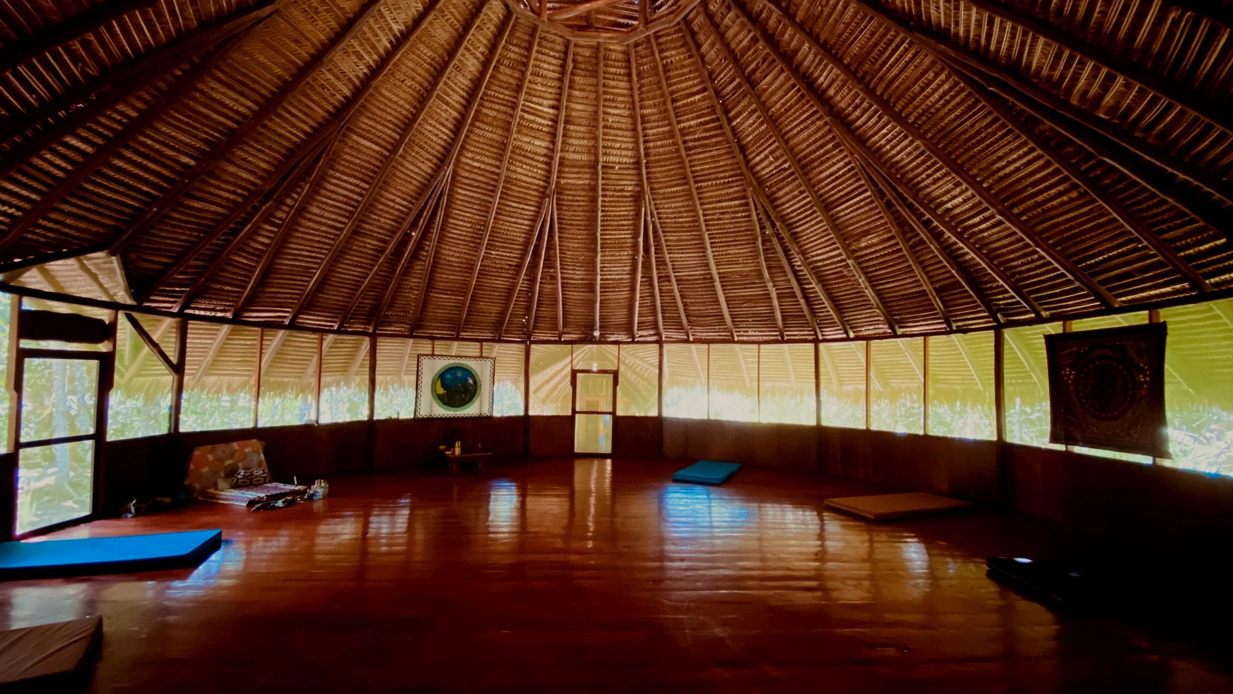 The maloka — the ceremonial hut at Ayaselva — built in the traditional Amazonian way, surrounded by jungle.
